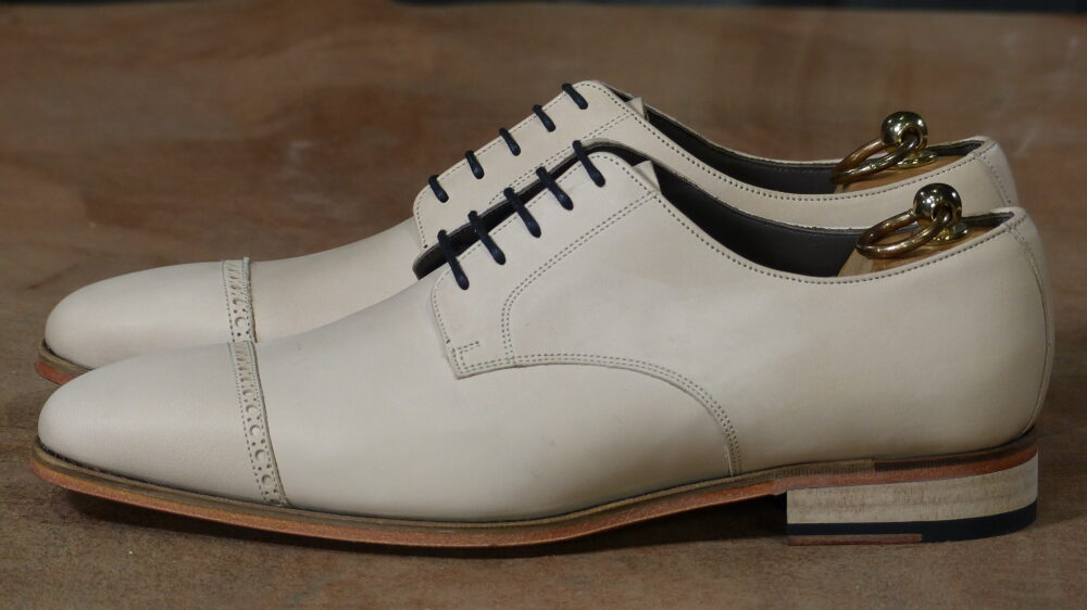 punched cap toe side view